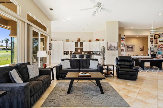 living room with billiards, ceiling fan, and light tile patterned flooring