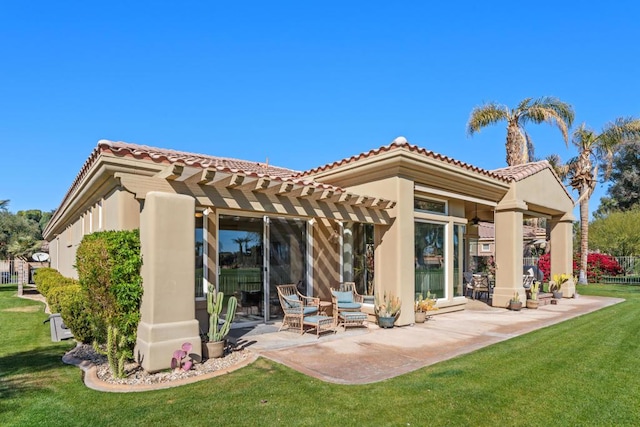 back of house featuring a pergola, a yard, and a patio area