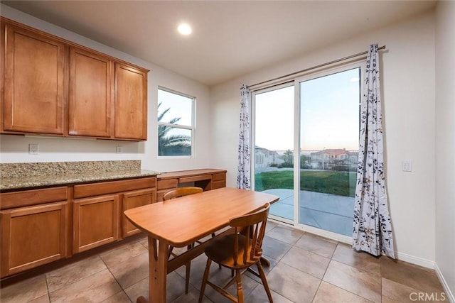 dining area featuring recessed lighting, light tile patterned flooring, and baseboards