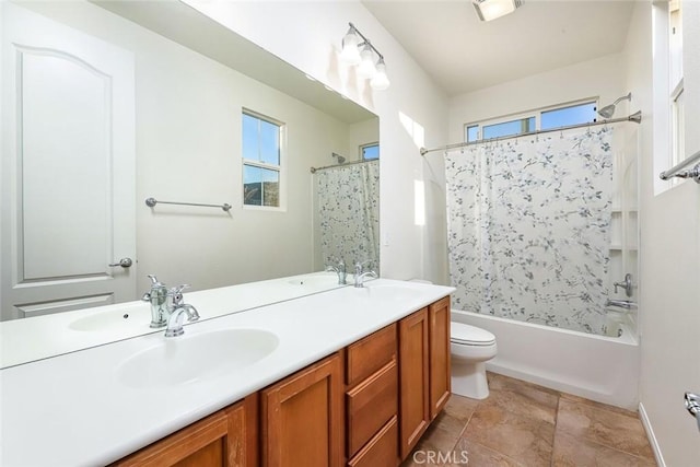 full bath featuring a sink, double vanity, and shower / bath combo with shower curtain