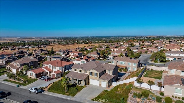 birds eye view of property with a residential view