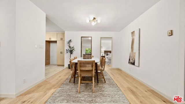 dining area with light wood-type flooring