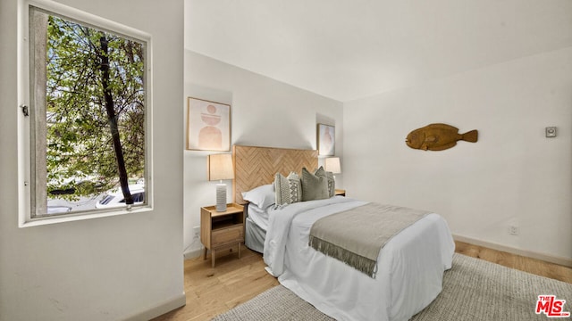 bedroom featuring light wood-type flooring