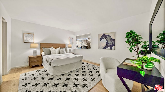 bedroom featuring wood-type flooring