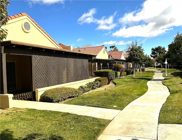 view of community featuring a lawn