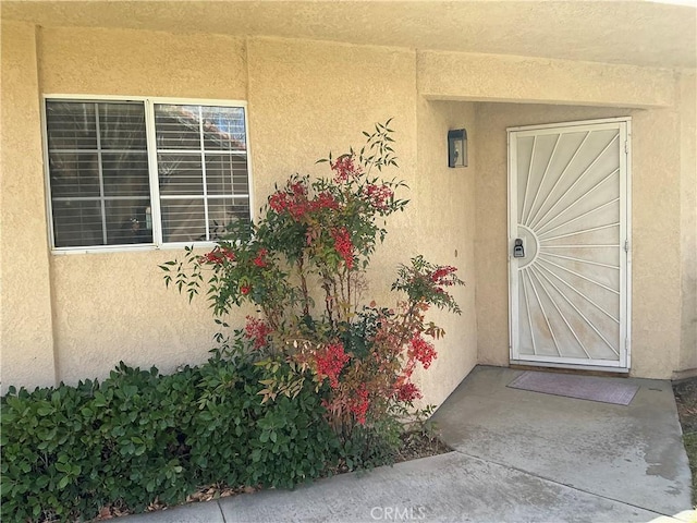 property entrance with a patio area