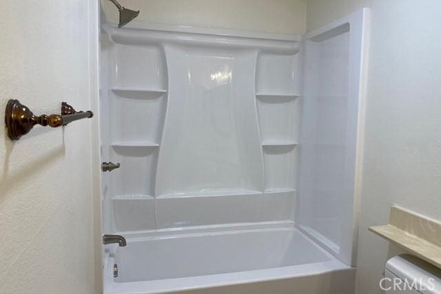 bathroom featuring toilet and shower / bathing tub combination