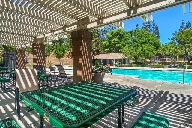 view of pool featuring a patio area and a pergola