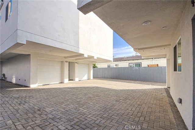 view of patio / terrace featuring a garage