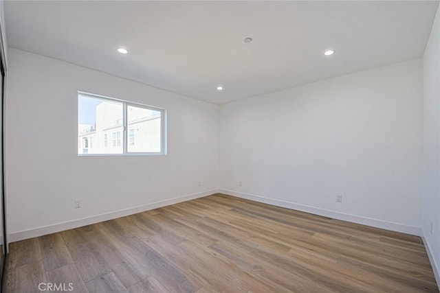 spare room featuring light wood-type flooring