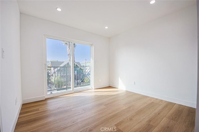 spare room with light wood-type flooring