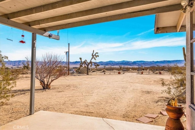 property view of mountains featuring a rural view