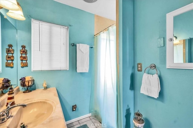 bathroom featuring tile patterned floors, a shower with shower curtain, and vanity