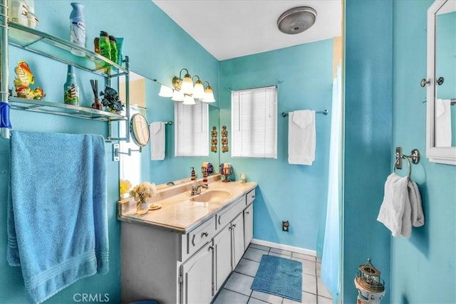 bathroom with tile patterned flooring and vanity