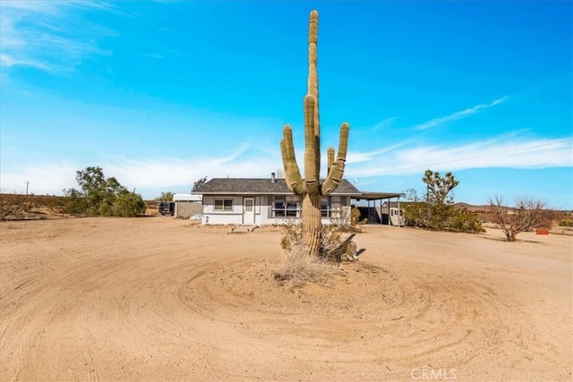 single story home featuring a carport