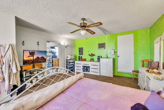 carpeted bedroom featuring ceiling fan, electric panel, and a textured ceiling