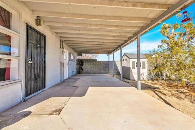 view of patio / terrace with a storage unit