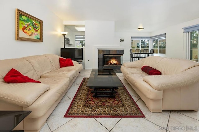 tiled living room with a fireplace