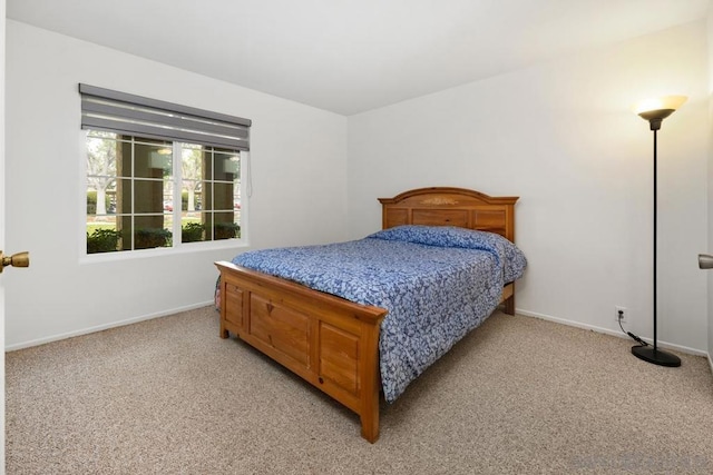 bedroom with light colored carpet