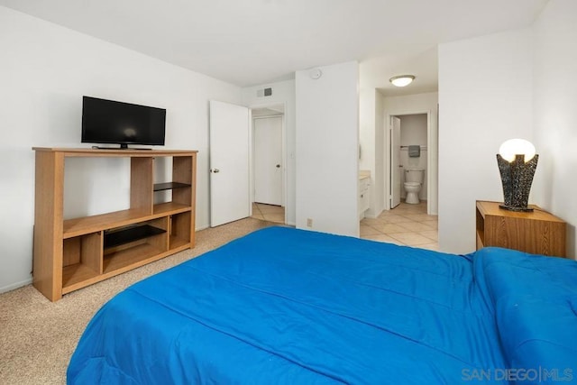 bedroom featuring ensuite bathroom