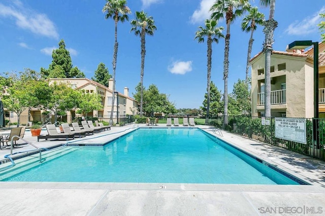 view of swimming pool with a patio