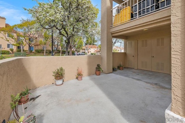 view of patio with a balcony