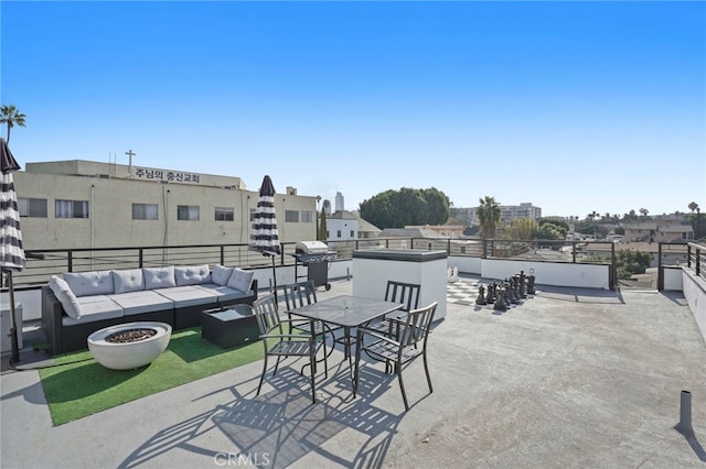 view of patio with outdoor dining space, an outdoor living space, and area for grilling