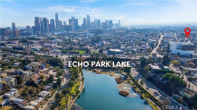 bird's eye view featuring a water view and a city view