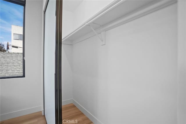 spacious closet featuring light wood-type flooring