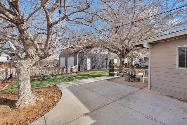 view of patio / terrace with a fire pit and a fenced backyard