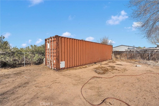 view of outbuilding featuring an outbuilding and fence