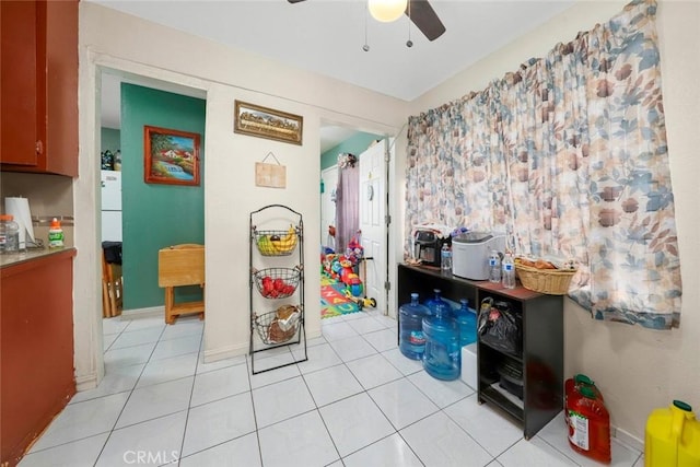 playroom featuring light tile patterned flooring and ceiling fan