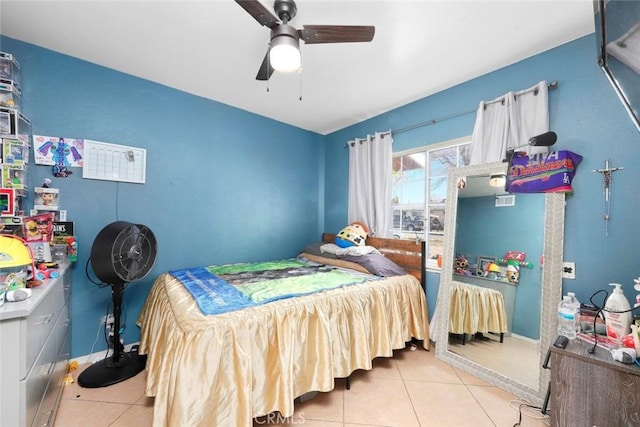 tiled bedroom with ceiling fan