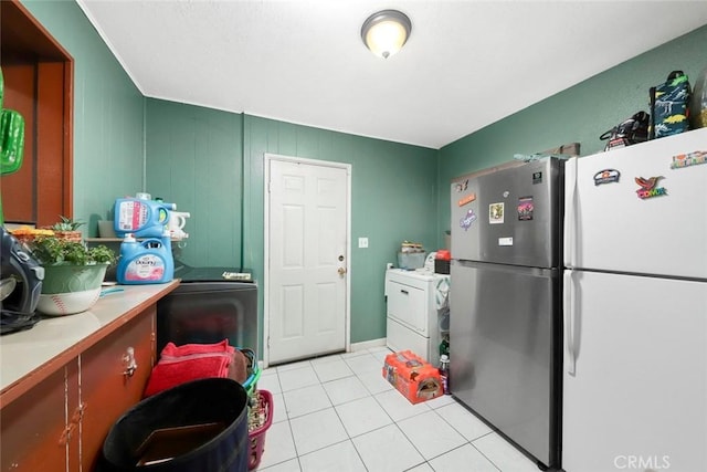 washroom with washer / clothes dryer and light tile patterned floors