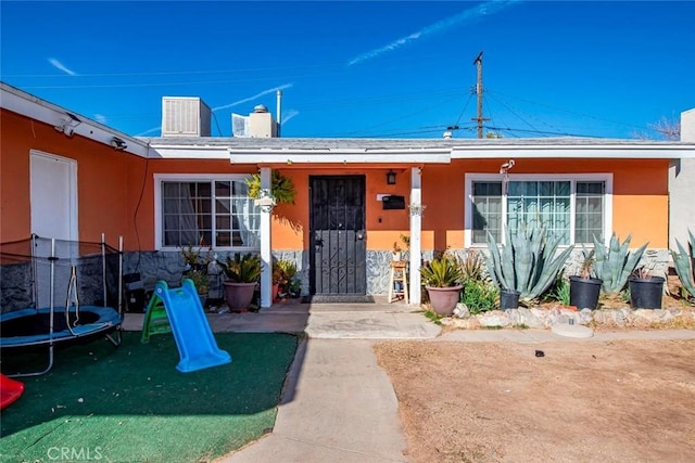 property entrance featuring a patio area