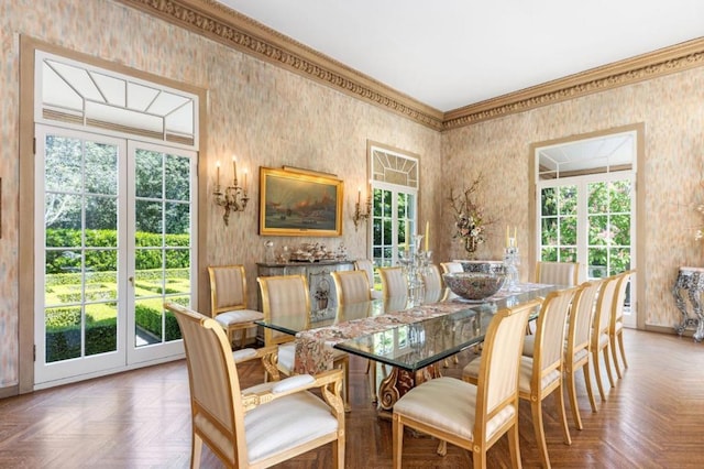 dining space with parquet flooring and a healthy amount of sunlight