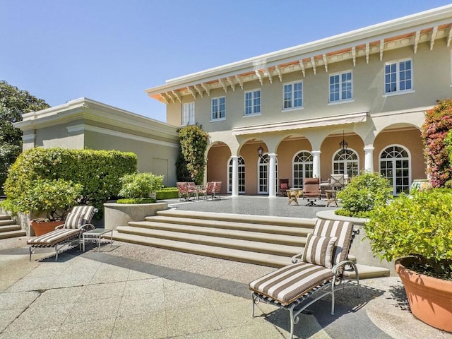 back of house with a patio