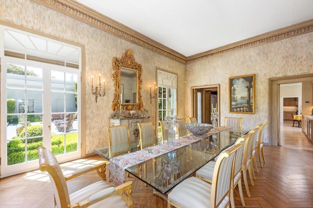 dining room with crown molding and parquet flooring