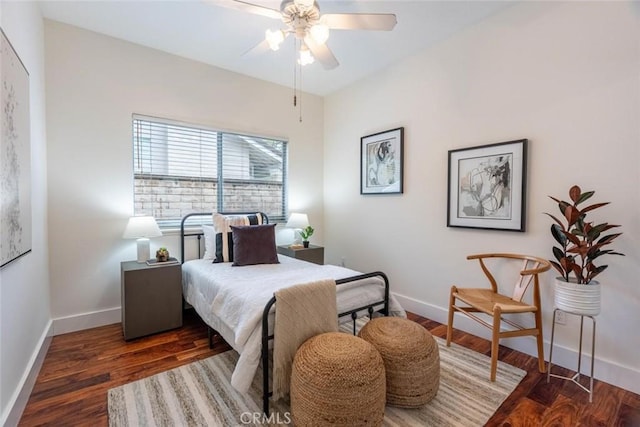 bedroom with dark wood-type flooring and ceiling fan