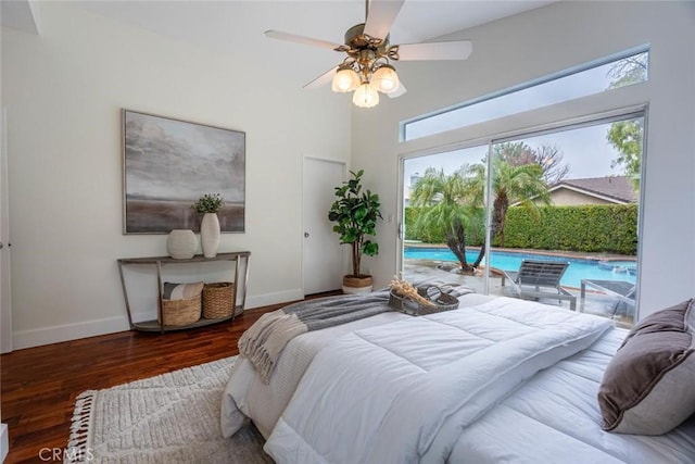 bedroom featuring dark hardwood / wood-style floors, access to outside, and ceiling fan