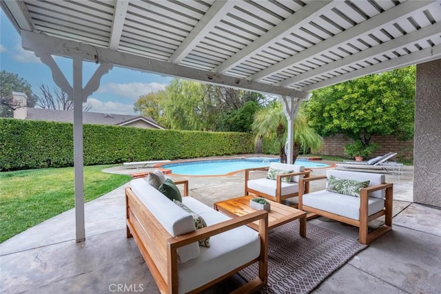 view of patio / terrace featuring outdoor lounge area and a pool with hot tub