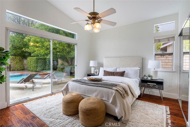 bedroom with ceiling fan, access to exterior, dark hardwood / wood-style flooring, and vaulted ceiling