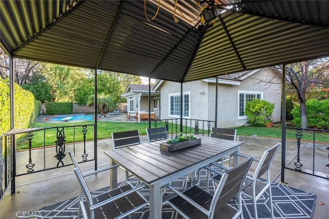 view of patio with a fenced in pool