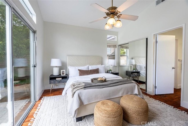 bedroom with dark wood-type flooring, access to exterior, and ceiling fan