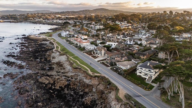 aerial view at dusk with a water view