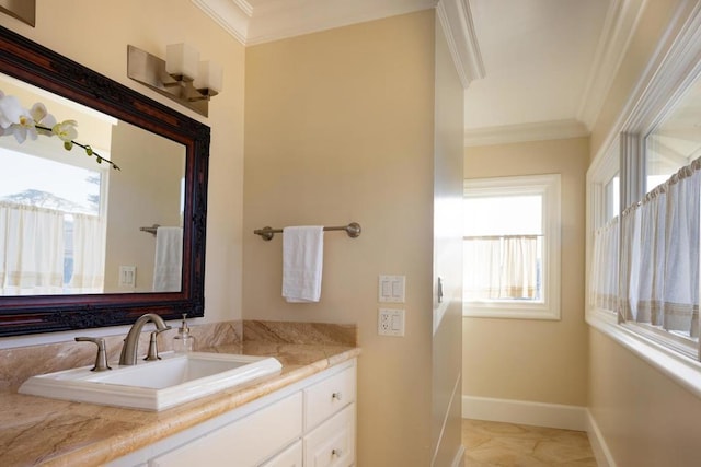 bathroom with crown molding and vanity