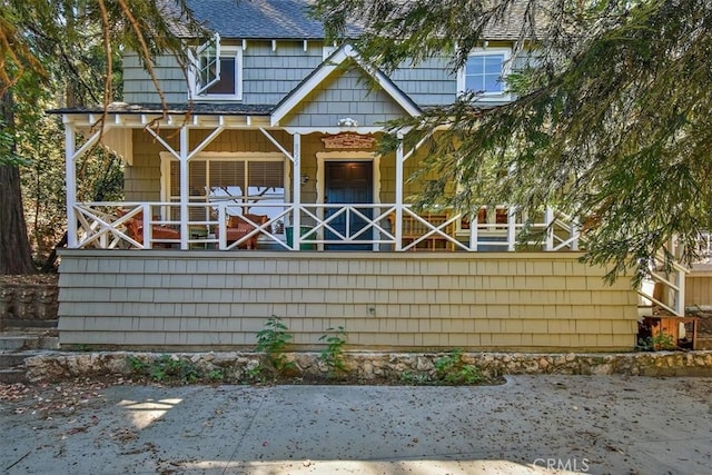 back of house with covered porch