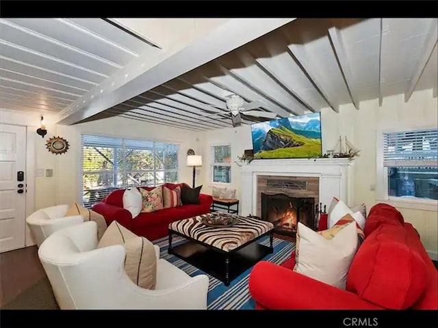 855 Lake Dr, Lake Arrowhead, CA 92352 - living area with beam ceiling, a premium fireplace, and wood finished floors