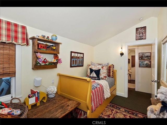 carpeted bedroom with vaulted ceiling