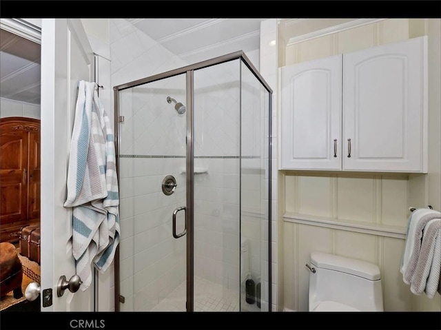 855 Lake Dr, Lake Arrowhead, CA 92352 - full bath featuring ornamental molding, a stall shower, toilet, and a decorative wall